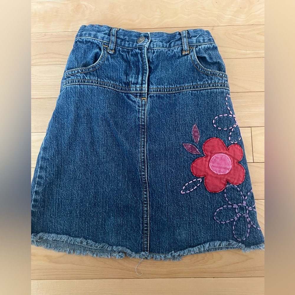 Kids mini boden denim skirt with embroidery detail.